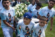Pallbearers carried the coffin of Marcoz, a 14-year-old killed in a car accident following a high-speed chase with deputies. 