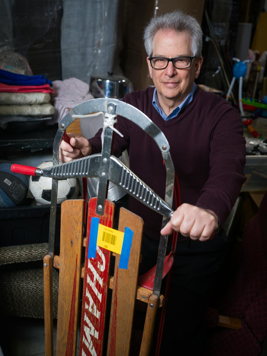 Joel Ackerman, a former UnitedHealth Group executive and startup founder, holds an item donated to Eden Prairie-based RedLadder, an online marketplace for people to trade items that result in a donation to a charity.