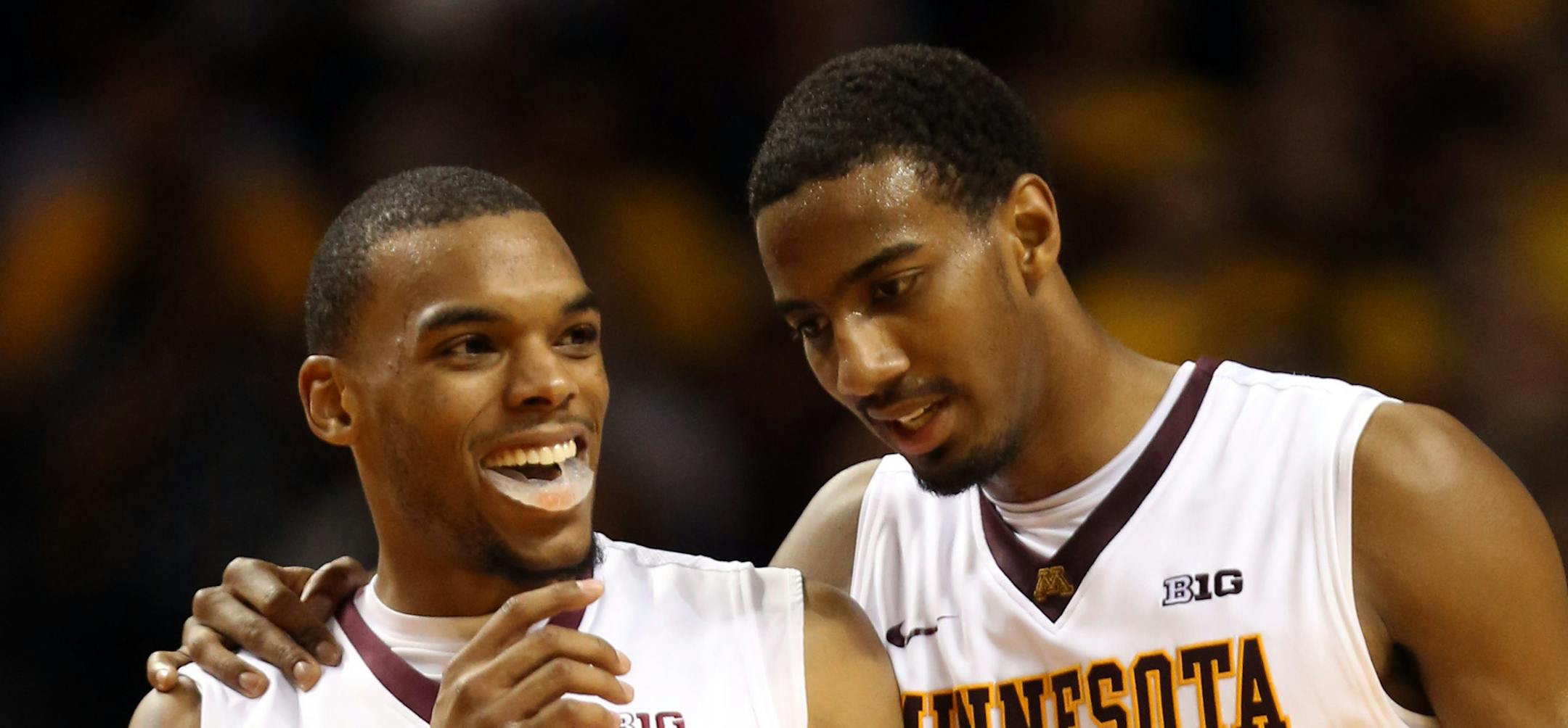 Gopher Austin Hollins, right congratulated Andre Hollins after a foul was called on Iowa during the second half at Williams Arena Tuesday, February 25, 2014. Gophers won over Iowa 95-89. ] (KYNDELL HARKNESS/STAR TRIBUNE) kyndell.harkness@startribune.com
