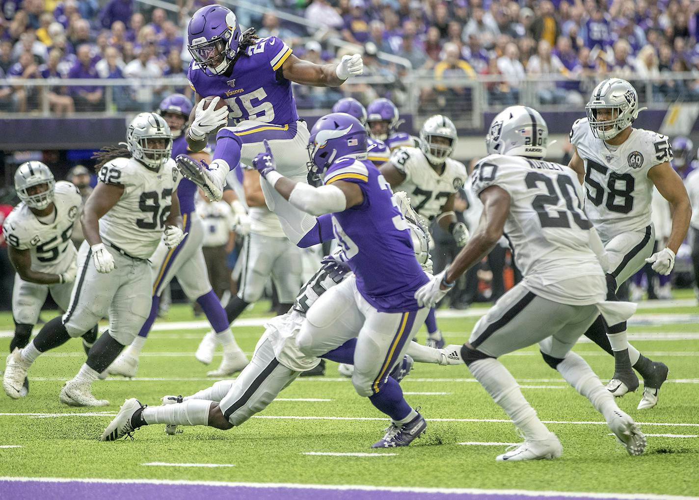 Minnesota Vikings running back Alexander Mattison hurdle over the Oakland Raiders defense for his first career touchdown in third quarter on Sunday, Sept. 22, 2019 at U.S. Bank Stadium in Minneapolis, Minn. (Elizabeth Flores/Minneapolis Star Tribune/TNS) ORG XMIT: 1439106