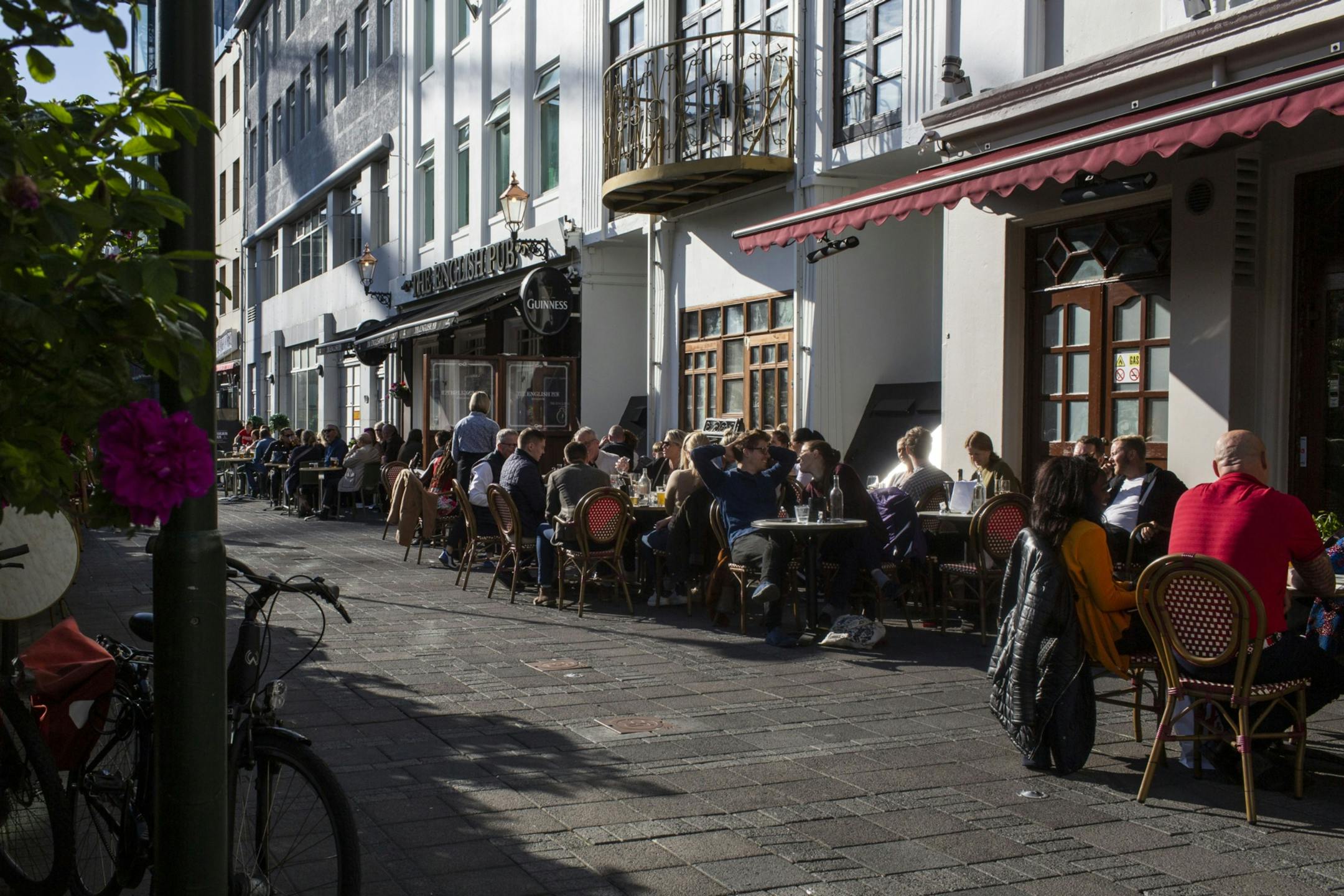 Customers sit at terraced tables outside restaurants and cafes in Reykjavik, Iceland, on July 19, 2020. MUST CREDIT: Bloomberg photo by Sigga Ella