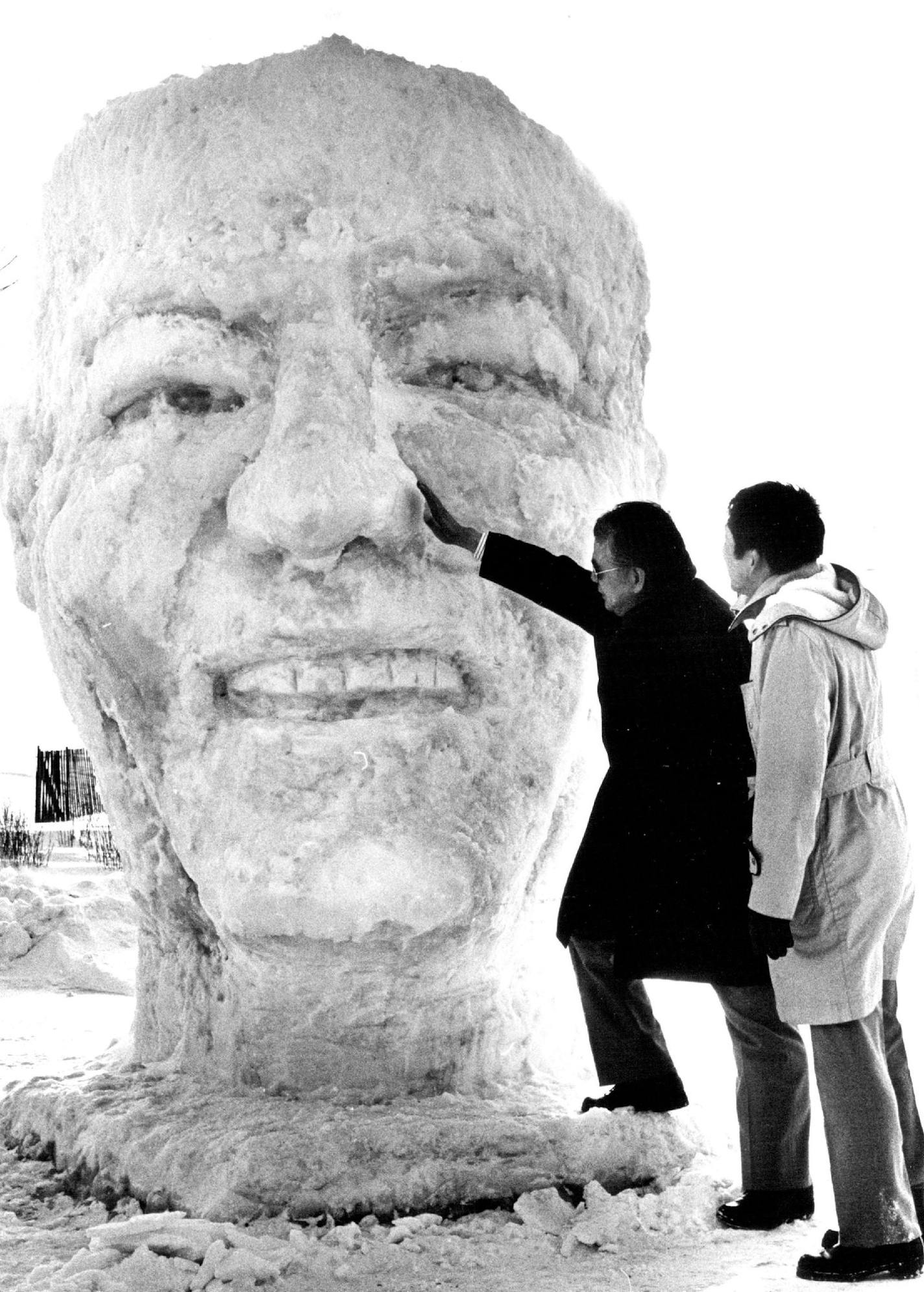 January 27, 1978 Japanese Snow Sculptors Depict HHH Tomoo Horikita, left, and Koichi Tada, members of a seven-man group of snow sculptors from Sapporo, Japan, presented a bust of the late Sen. Hubert H. Humphrey to the people of Minnesota Thursday. The show portrait is located at the entrance to the Minnesota Mining and Manufacturing (3M) Co. headquarters off Interstate Hwy. 94 in Maplewood. Horikita is director of economic affairs for the city of Sapporo and spokesman for the group, which came