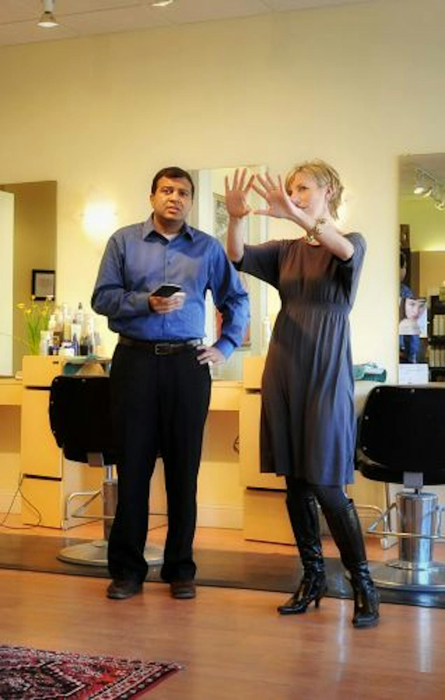 Salon Aura manager Susan Johnson and owner Ashish Aggarwal talked over remodeling plans for the Edina salon that must be completed for the salon's grand opening celebration on March 12.