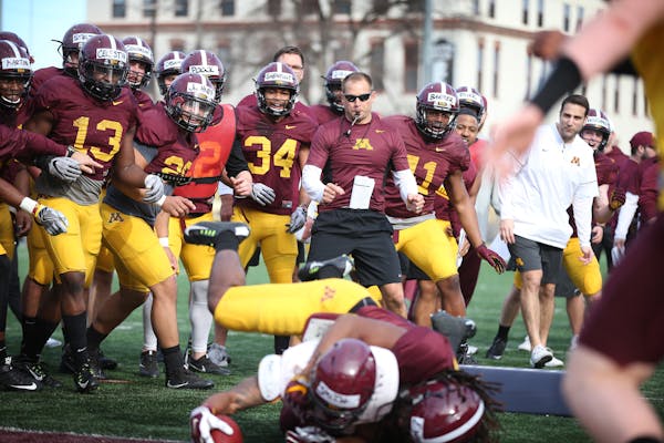 Gophers head coach P.J. Fleck reacted with his team during spring practice one on one drills