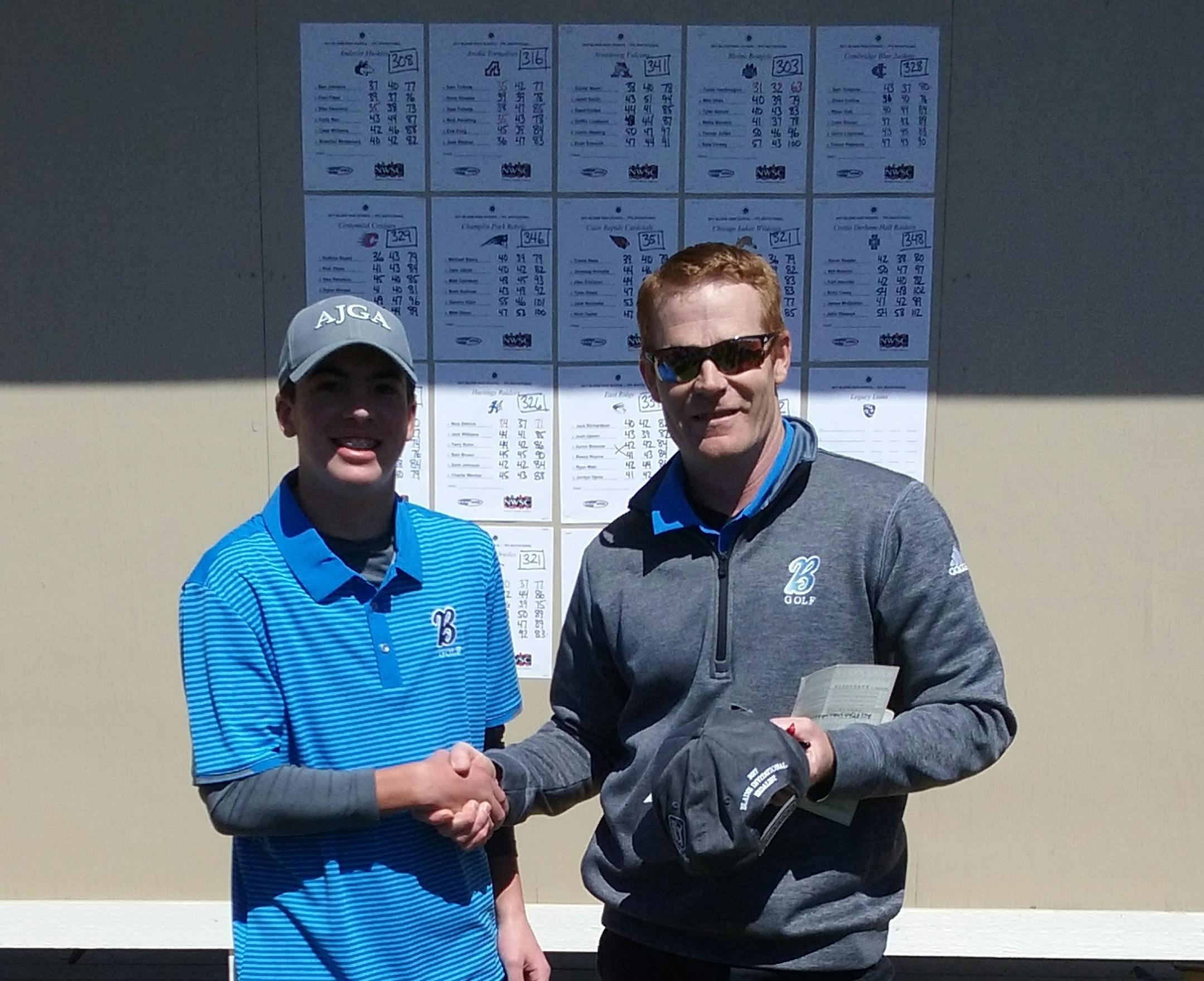 Blaine sophomore Caleb VanArragon and coach Kevin Overgaard after VanArragon shot what is believed to be a boys' state-record round of 63.
