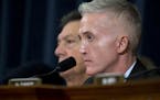 House Benghazi Committee Chairman Rep. Trey Gowdy, R-S.C. listens as Democratic presidential candidate, former Secretary of State Hillary Rodham Clint