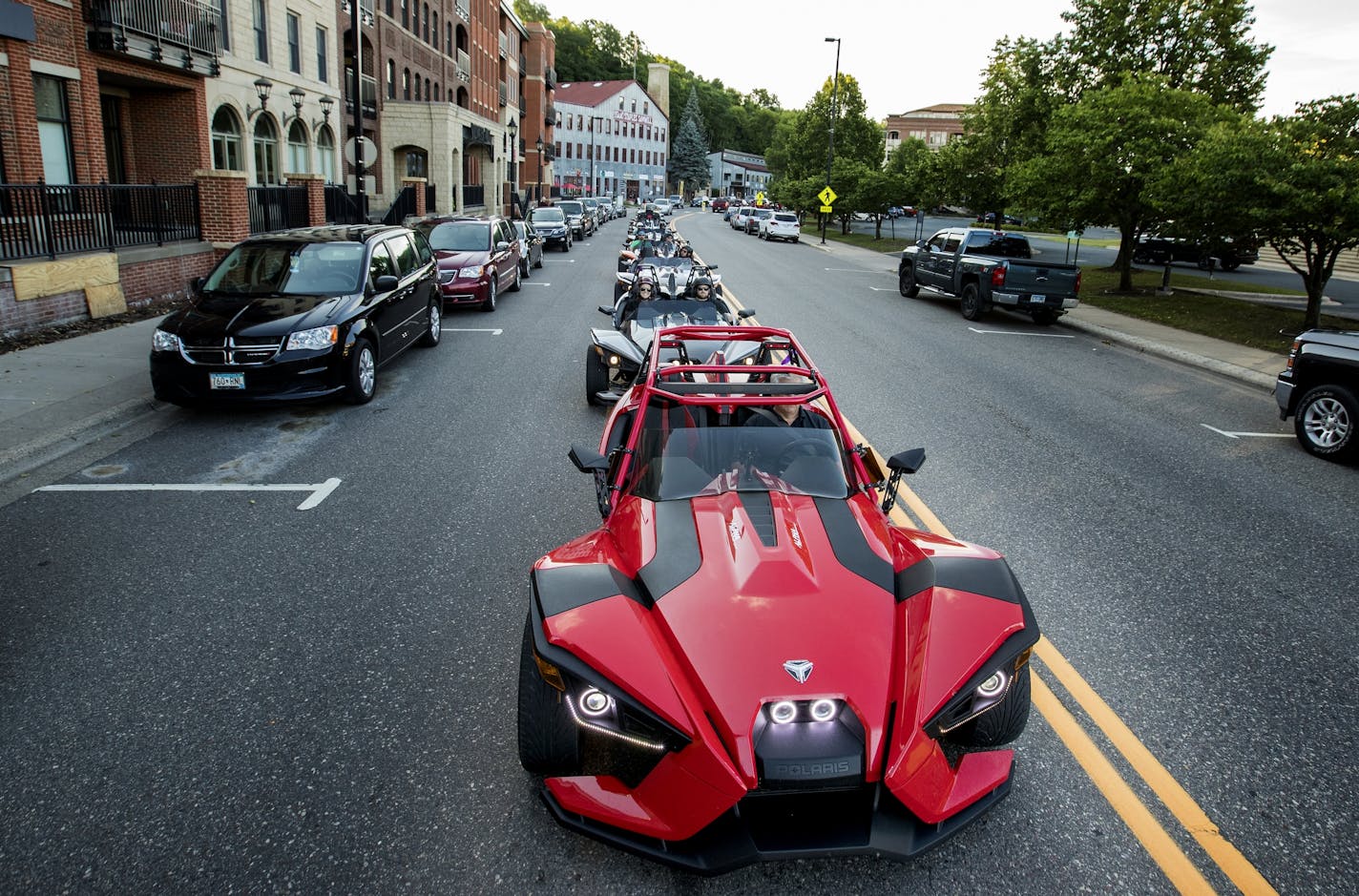 Slingshots made their way through Stillwater during a Polaris Slingshot owner's charity ride for Road 2 Recovery on Wednesday.