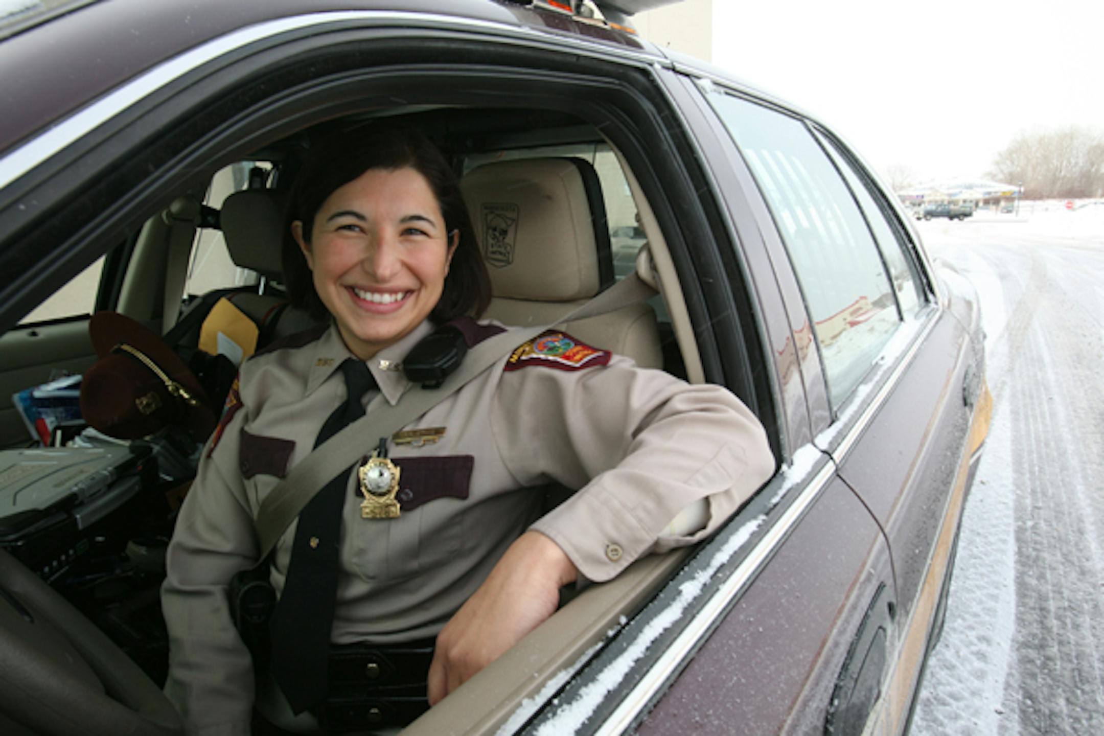 Trooper Pilar Stone, originally from Argentina, says she's proud to wear the maroon, the color of the trim on the Minnesota state trooper uniform.