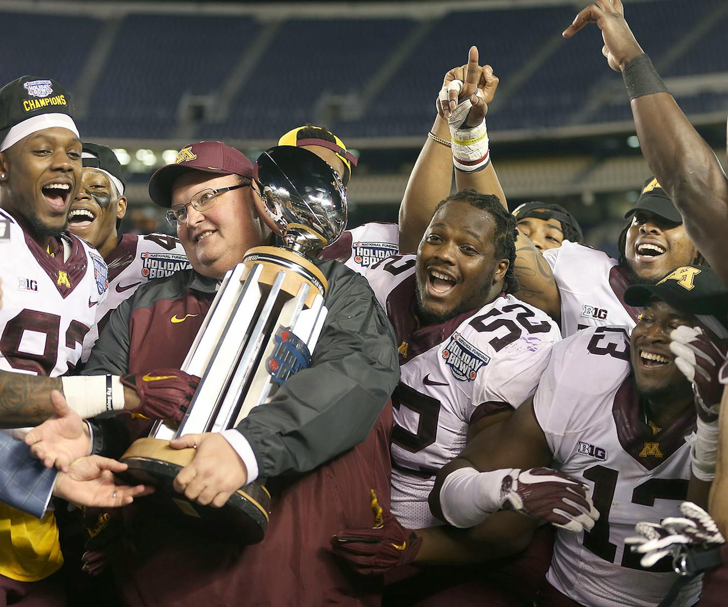 Minnesota's head coach Tracy Claeys received the Holiday Bowl trophy alongside the team after they defeated Washington State 17-12 at Qualcomm Stadium for the San Diego Holiday Bowl, Tuesday, December 27, 2016 in San Diego, CA.