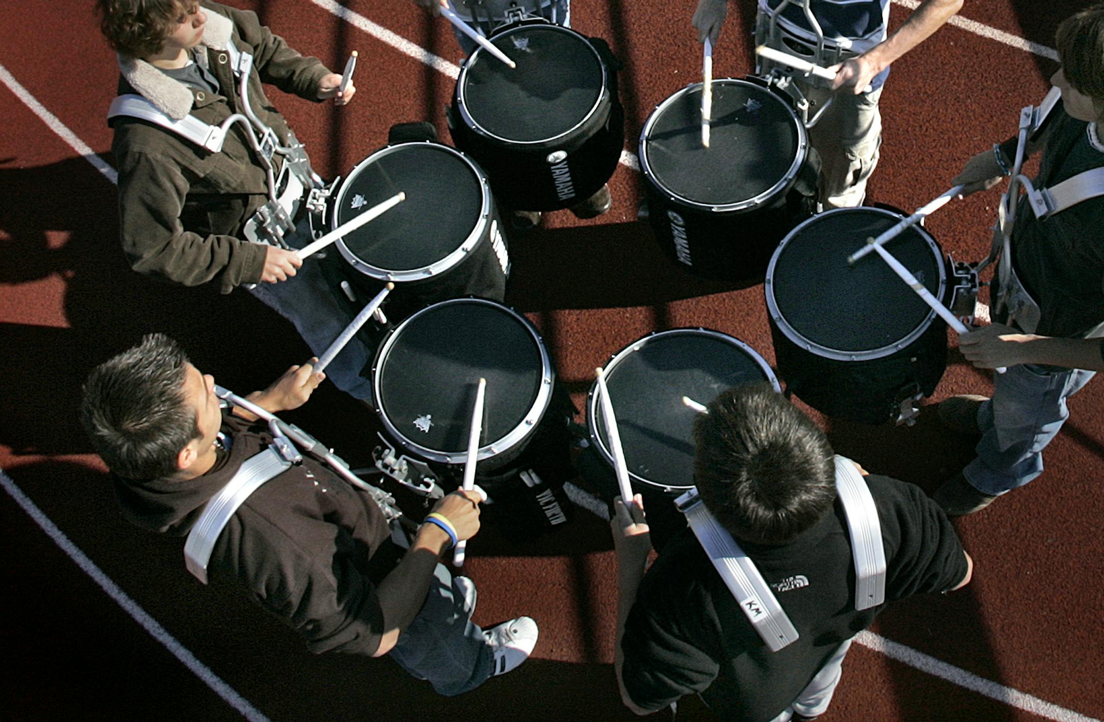 JIM GEHRZ • jgehrz@startribune.com
Minneapolis/October 27, 2006/11:30AM
Members of the Eden Prairie High School marching band practice playing snare drums at the school’s football field in preparation for Saturday’s marching band competition at the Metrodome. JIM GEHRZ • jgehrz@startribune.com
Minneapolis/October 27, 2006/11:30AM
Members of the Eden Prairie High School marching band practice playing snare drums at the school’s football field in preparation for