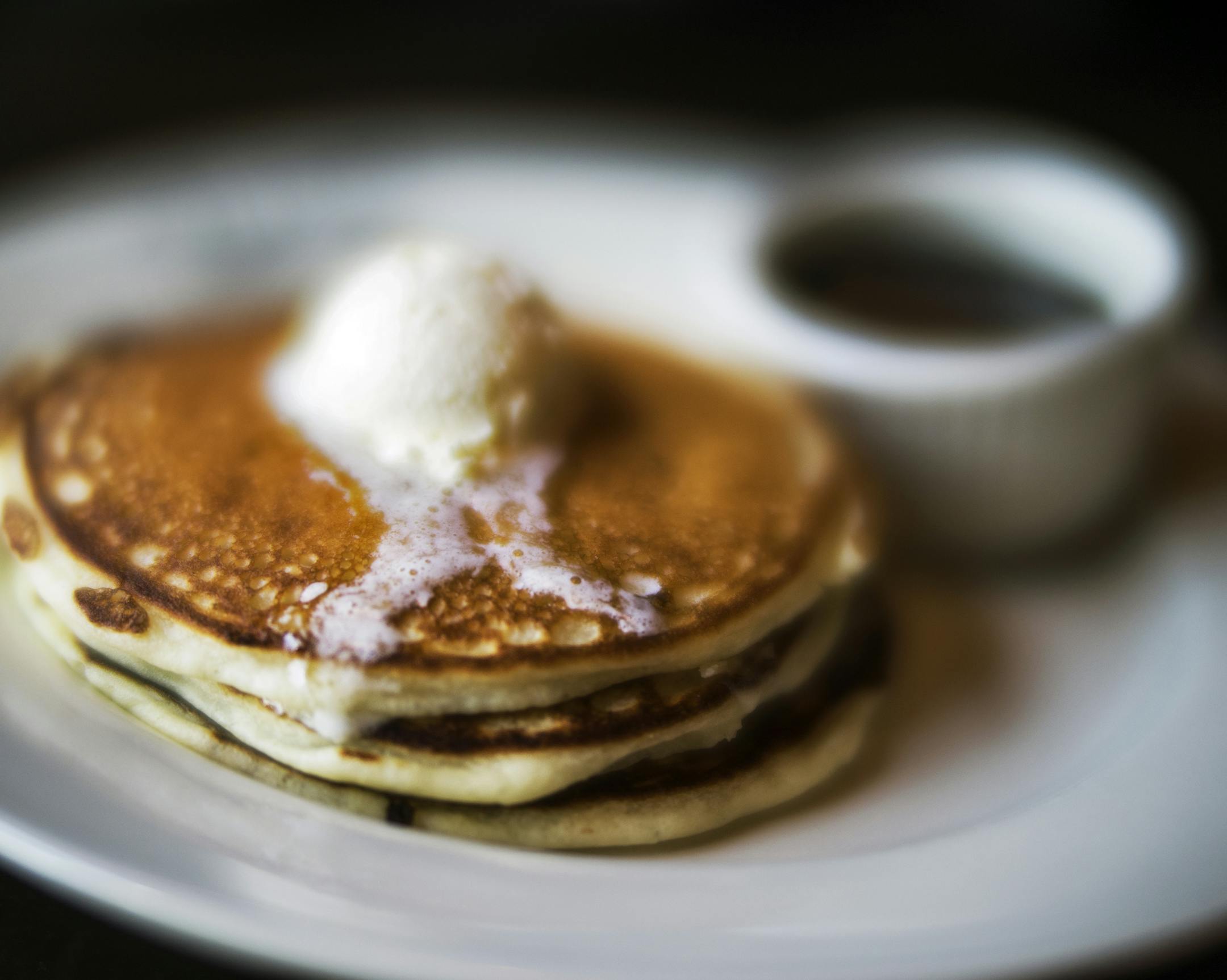 The short-stack pancakes with whipped butter and maple syrup at Nighthawks.