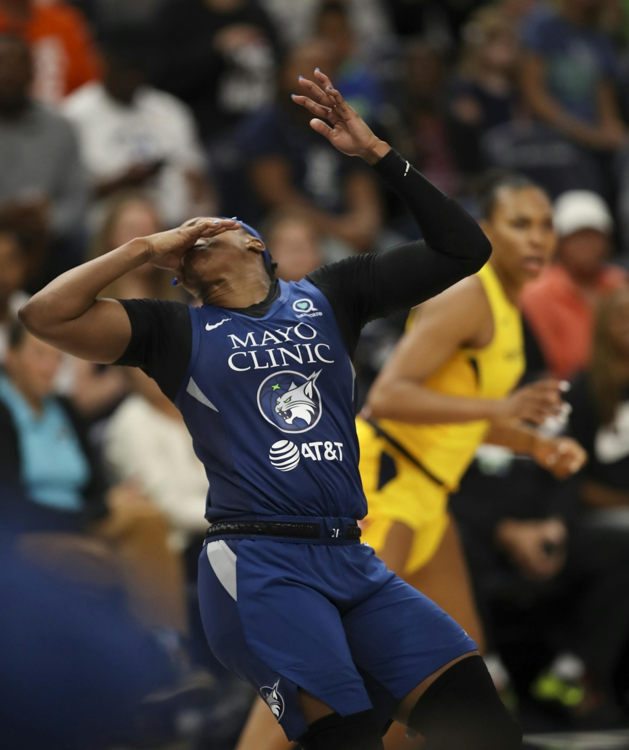 Minnesota Lynx guard Odyssey Sims (1) reacted to a hand to face by Indiana Fever center Teaira McCowan (15) in the fourth quarter.