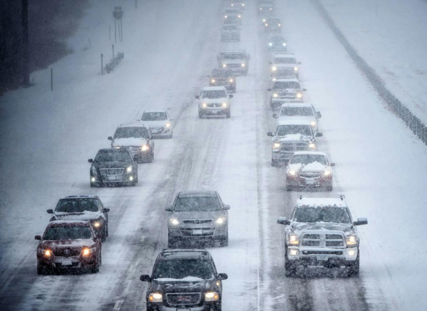 Traffic was moving slow Tuesday afternoon on I-35E as southbound drivers left work early due to the heavy snow.