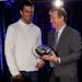 New England Patriots quarterback Tom Brady poses with NFL Commissioner Rodger Goodell after last year's Super Bowl.