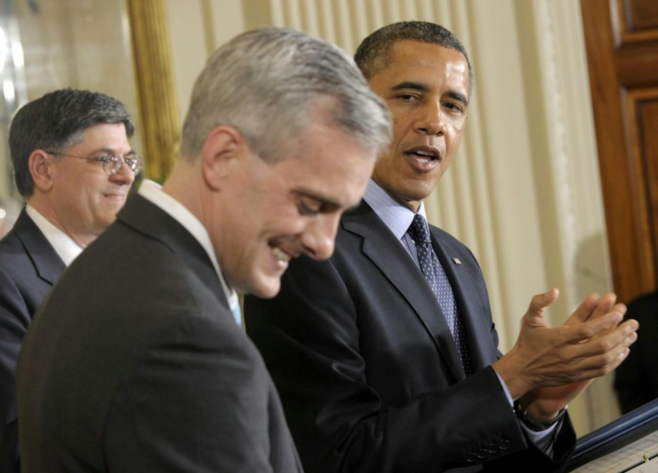 President Barack Obama applauds current Deputy National Security Adviser Denis McDonough, center, in the East Room of the White House in Washington, Friday, Jan. 25, 2013, where he announced McDonough as his next chief of staff, replacing current Chief of Staff Jack Lew, left, who the president nominated to become treasury secretary.