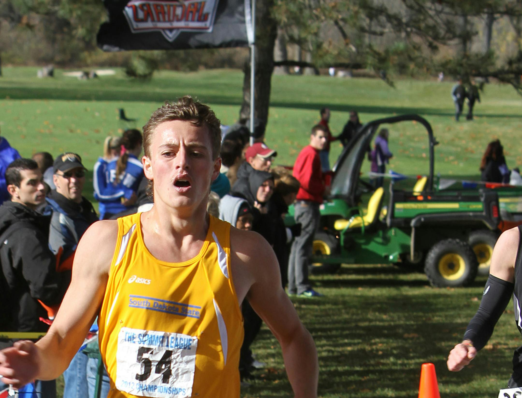 Caption: Phillip LaVallee crossing the finish line at the 2012 Summit League Cross Country Championships. He placed 15th in the meet during his freshman season at South Dakota State University.