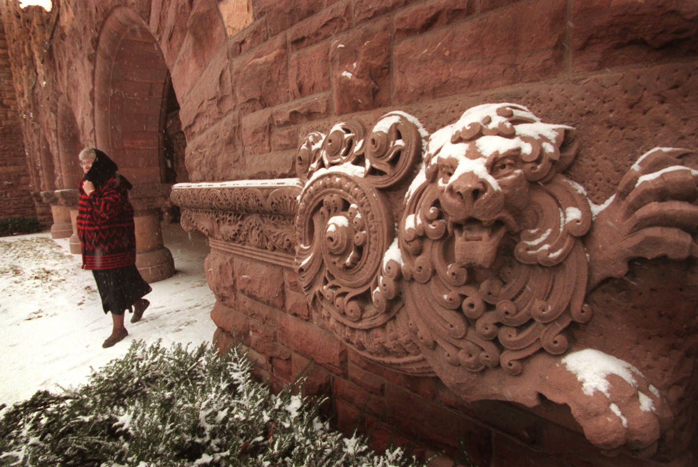 Pillsbury Hall features deep arches, a turret, a granite-trimmed portico and whimsical decorative elements.