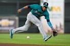 Mariners second baseman Jorge Polanco fielded a grounder against Houston on Sunday. Polanco has gotten off to a slow start with his new team since his