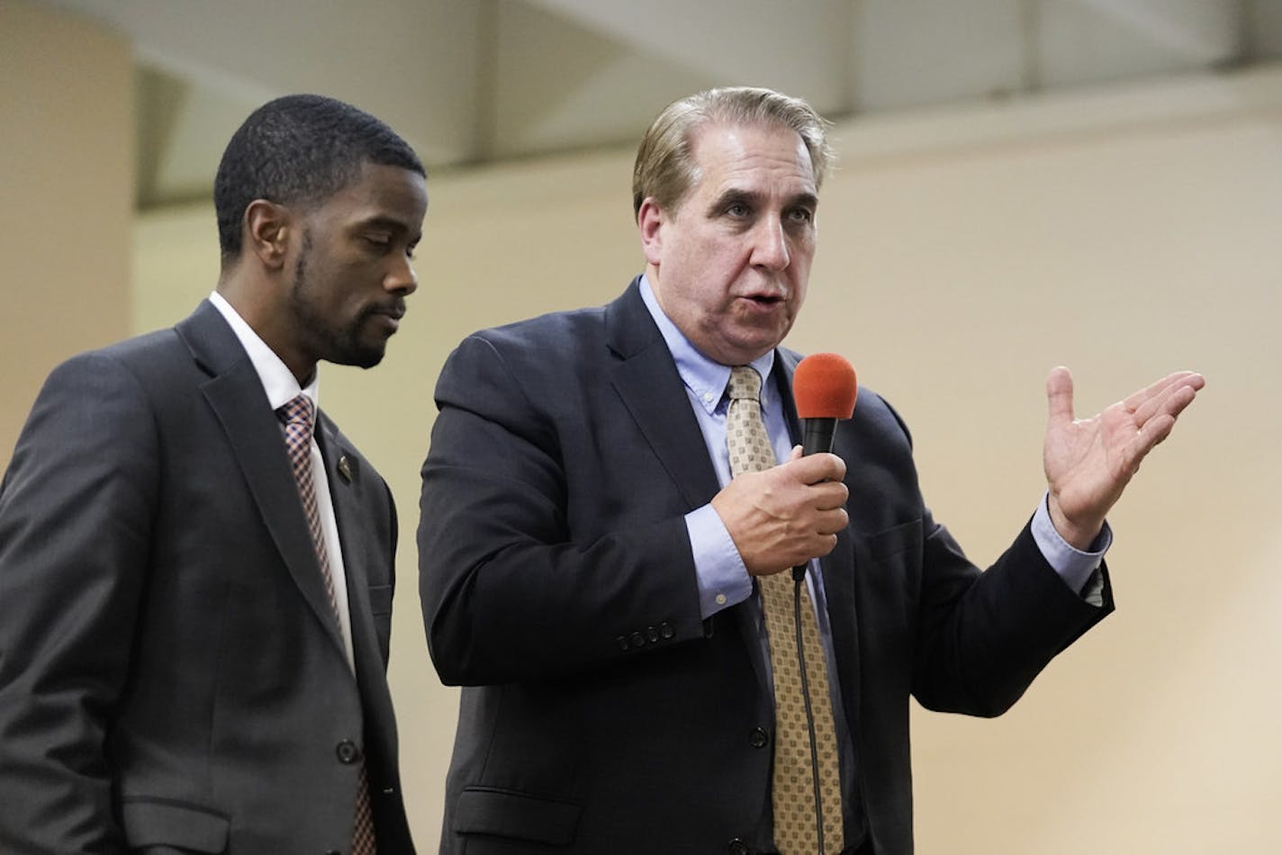 St. Paul Mayor Melvin Carter, left, and Ramsey County Sheriff Bob Fletcher shared opposing views at Wednesday's meeting on installing ShotSpotter technology.