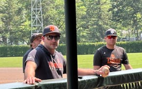 Coach Toby Hanson talks to his Delano baseball team during practice Tuesday.