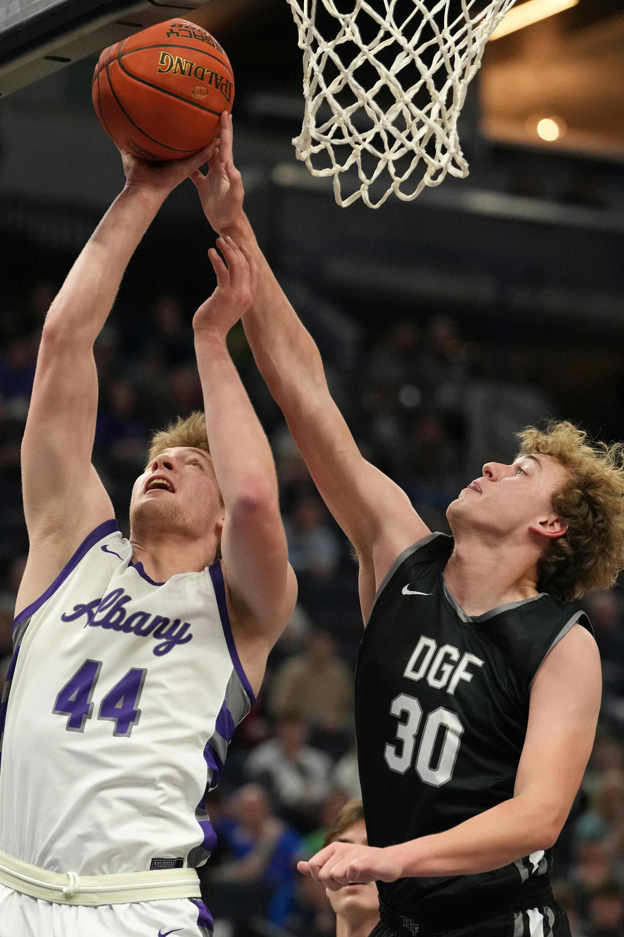 Albany center Ethan Borgerding (44) goes up for a shot as DGF forward Grant Anderson (30) defends in the first half.
