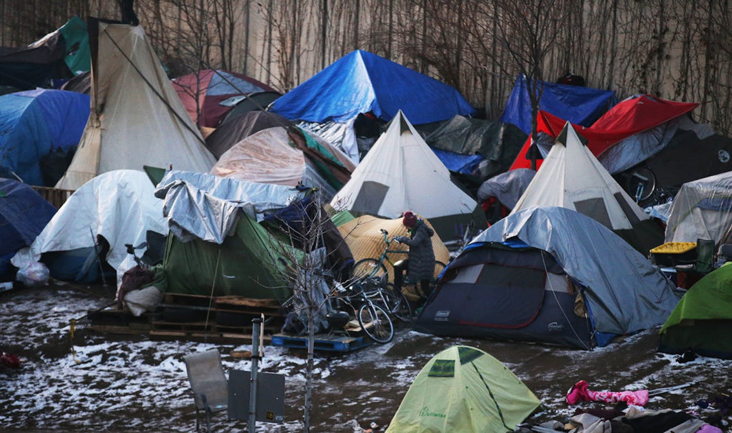 A new state Medicaid program will provide housing services to people with mental health problems and other disabilities, and help them avoid becoming homeless. In 2018, hundreds of people lived in tents at this homeless camp along Hiawatha Ave. in Minneapolis.