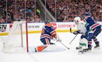 The Canucks' Brock Boeser (6) scores on Oilers goalie Stuart Skinner (74) during the first period of Game 3 of their playoff series Sunday night.