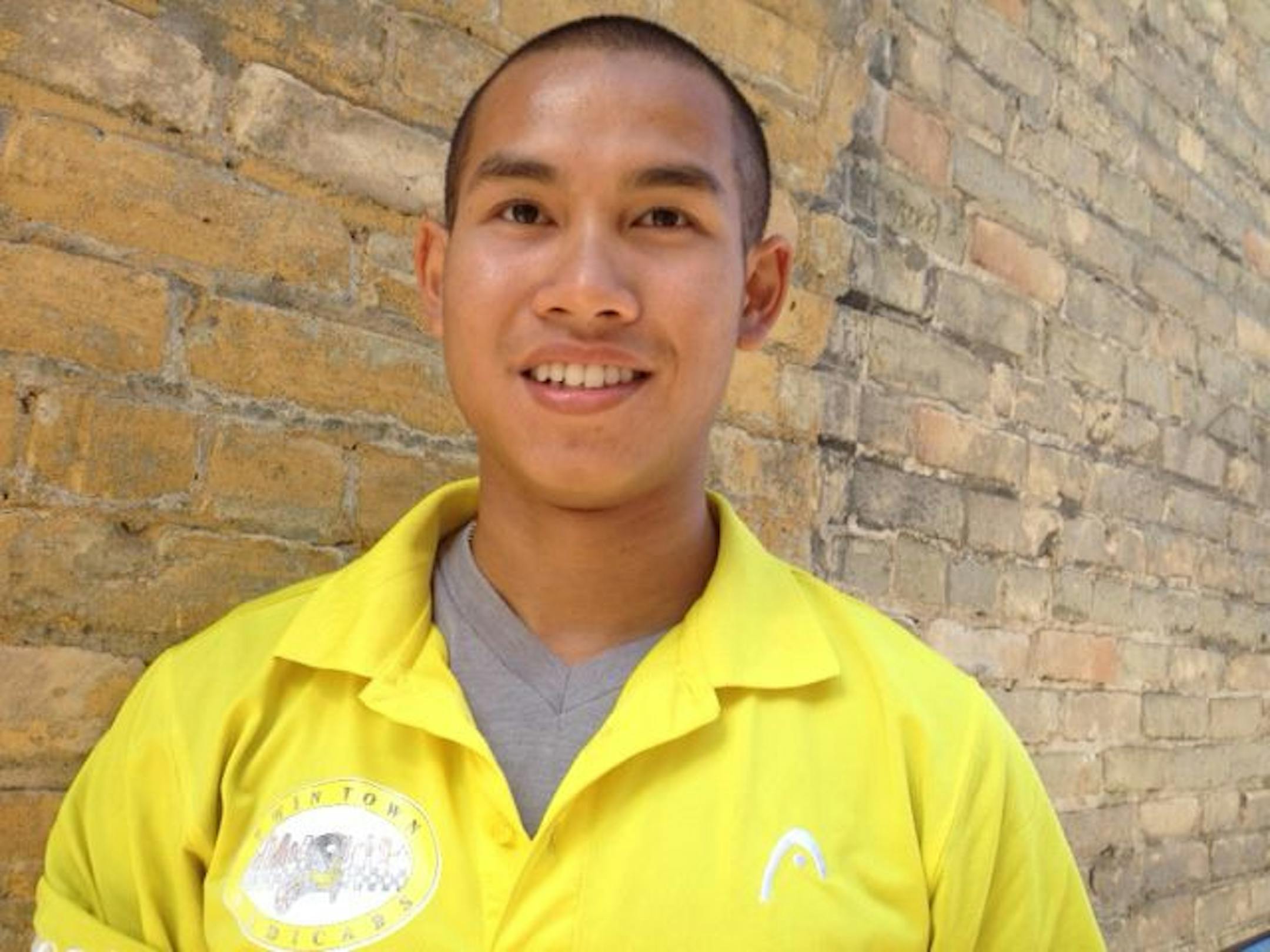 Lucky Phousirith spent his summer operating a bike cab in Minneapolis before returning the UMD, where he's a pole vaulter on the track team. Photo by CURT BROWN