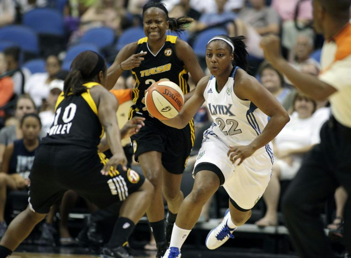 Lynx guard Monica Wright brought the ball upcourt against Tulsa guard Andrea Riley last Sunday as the Lynx crushed the Shock 82-54 at Target Center.