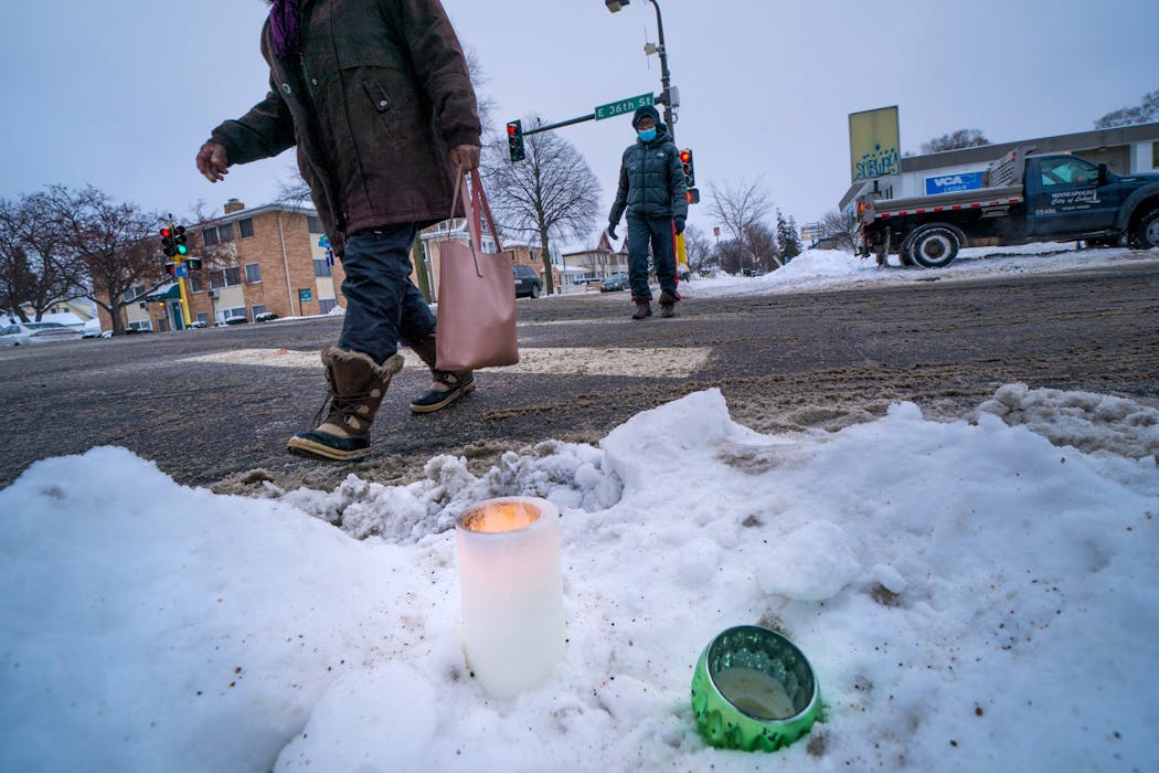A candle burned near the intersection of Cedar Avenue South and E. 36th Street, the scene of Wednesday night's shooting.
