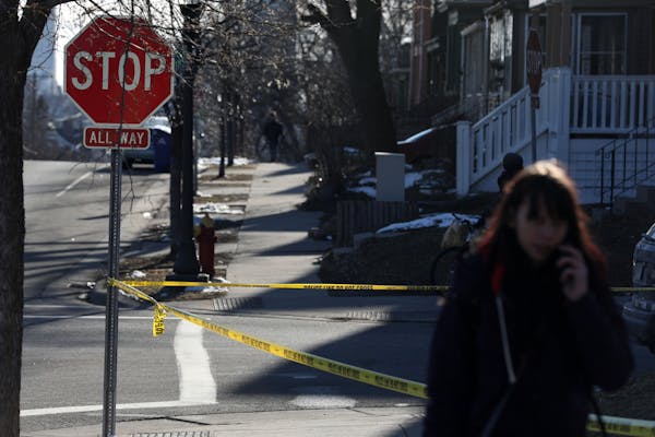Police tape surrounded the scene in the 700 block of Sixth Street East in Saint Paul, Minn.
