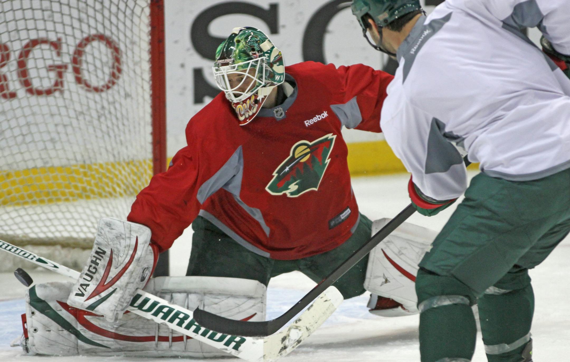 Minnesota Wild goalie Niklas Backstrom stopped Zenon Konopka's shot during practice.