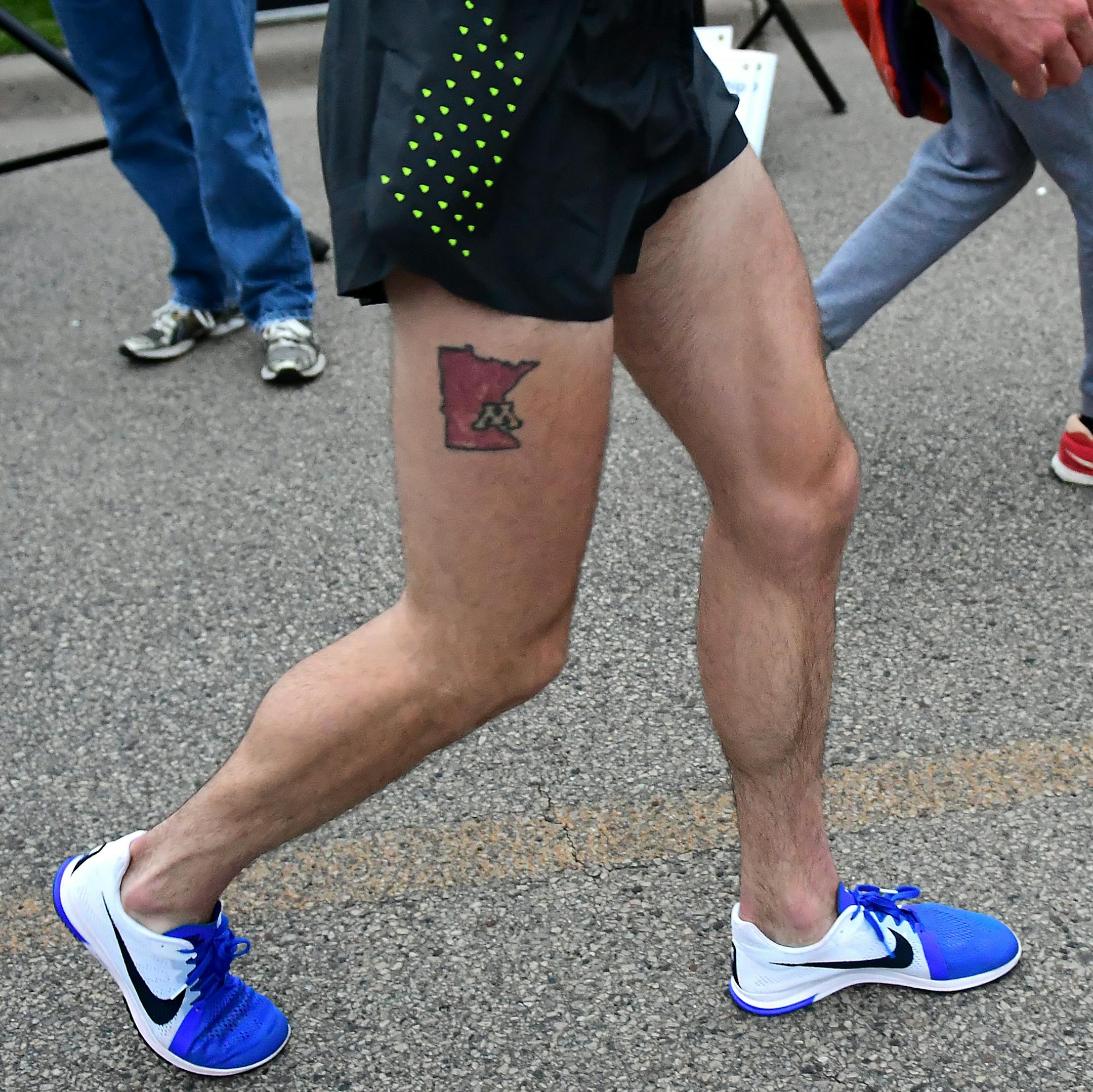 Stillwater native and former Gopher runner Ben Blankenship represented Minnesota and the University of Minnesota with a state-shaped tattoo with the university's logo Thursday at the TC 1 Mile.