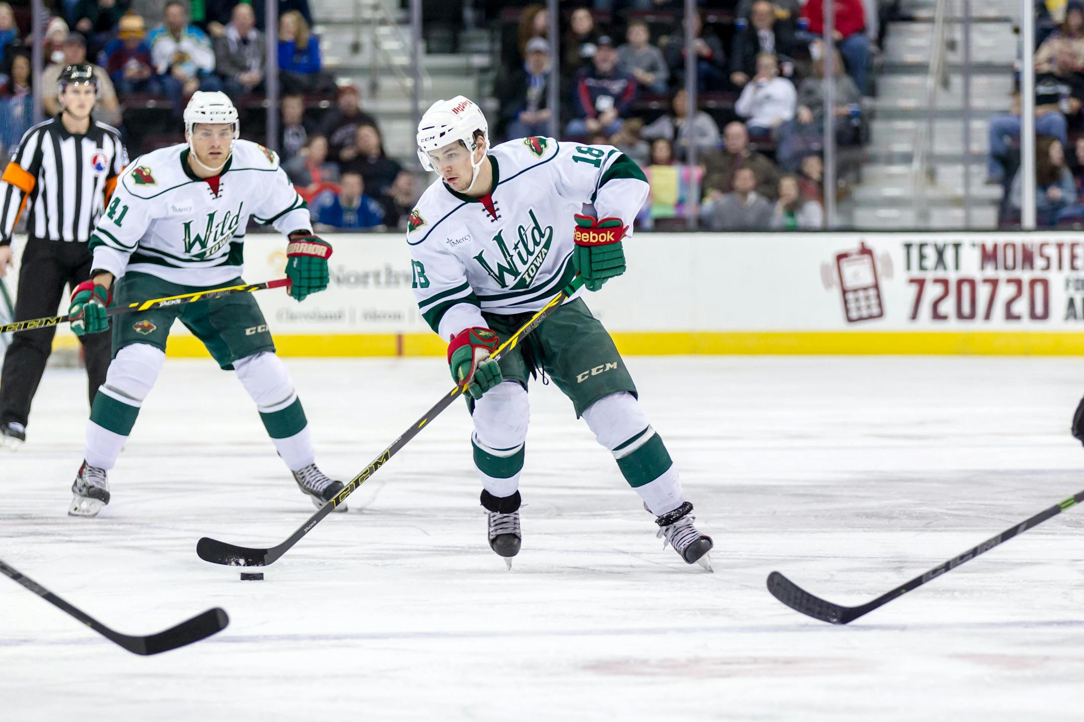Zack Mitchell carries the puck during the game between the Iowa Wild and Lake Erie Monsters at Quicken Loans Arena in Cleveland last February.