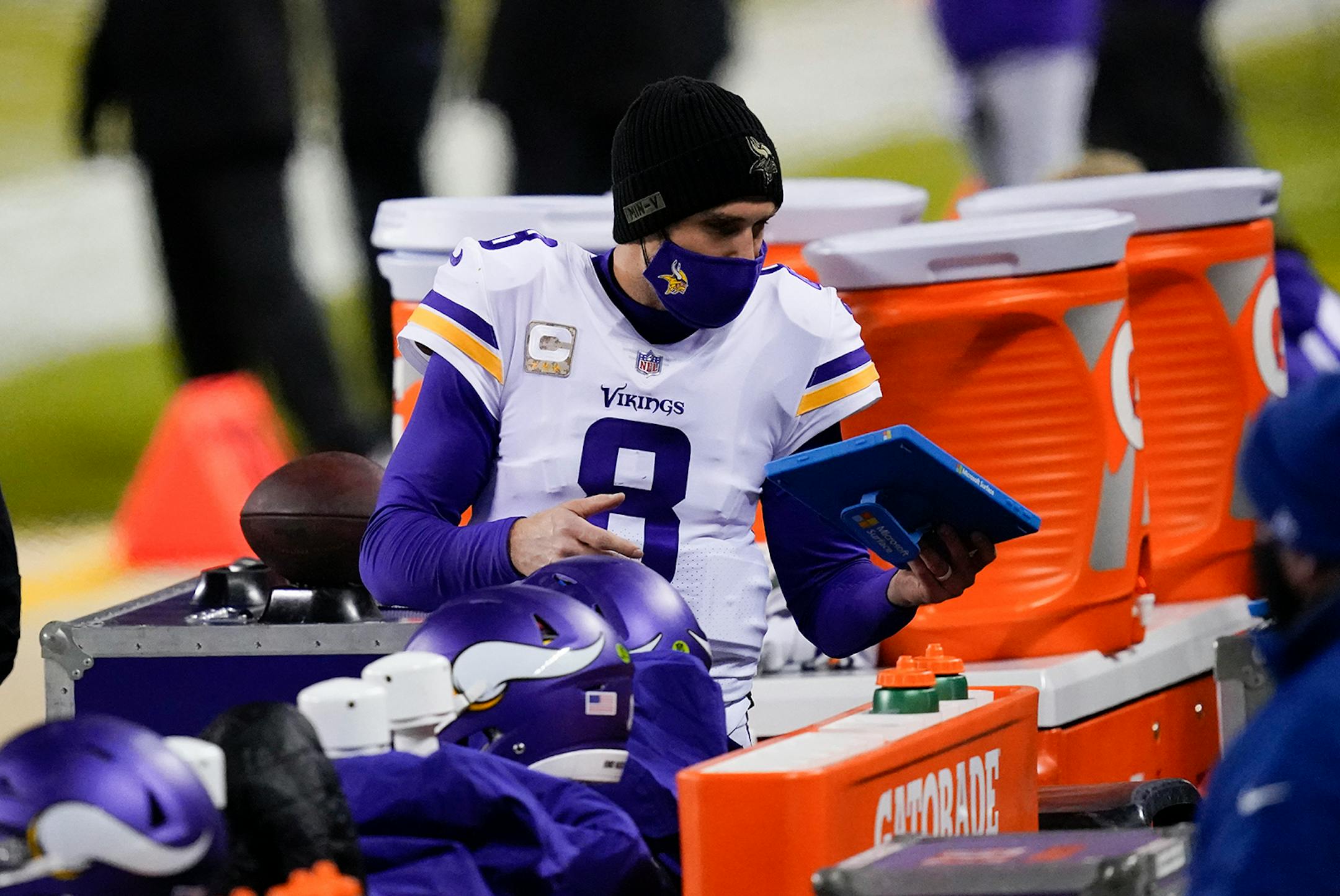Minnesota Vikings quarterback Kirk Cousins stands on the sideline during the second half of an NFL football game against the Chicago Bears Monday, Nov. 16, 2020, in Chicago. (AP Photo/Charles Rex Arbogast)