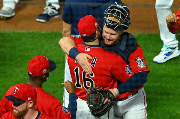 Twins catcher Ryan Jeffers was greeted by teammates and coaches, including fellow catcher Alex Avila (16), after Jeffers' big league debut which inclu