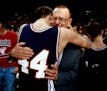 Coach Bob McDonald embraces his son, Joel McDonald, after Chisholm won the Class A State Tournament Title in 1991l