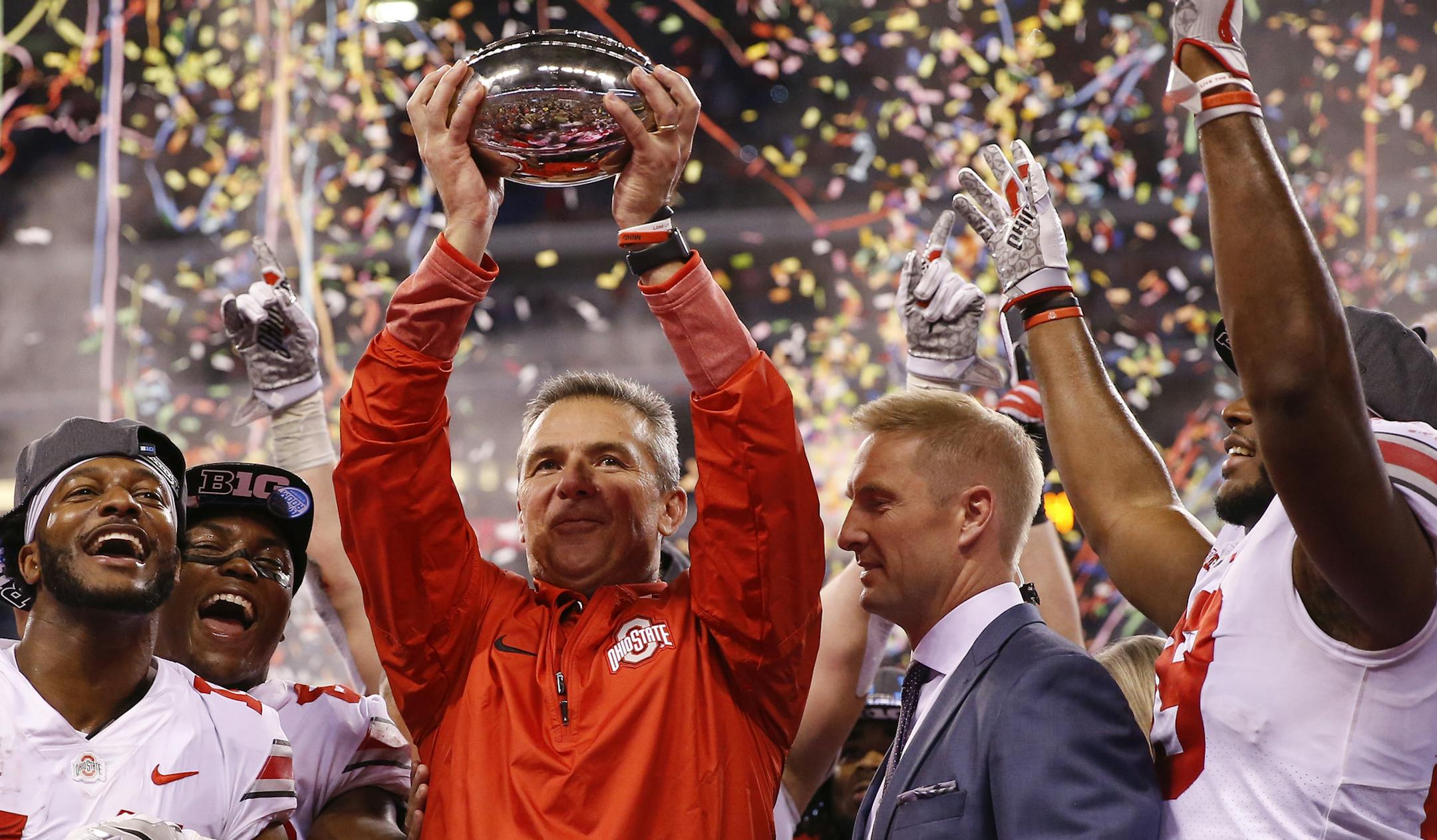 Ohio State Buckeyes head coach Urban Meyer celebrates with his team after their 27-21 Big Ten Champsionship win over the Wisconsin Badgers at Lucas Oil Stadium Sunday, Dec. 3, 2017 in Indianapolis. (Sam Riche/TNS)