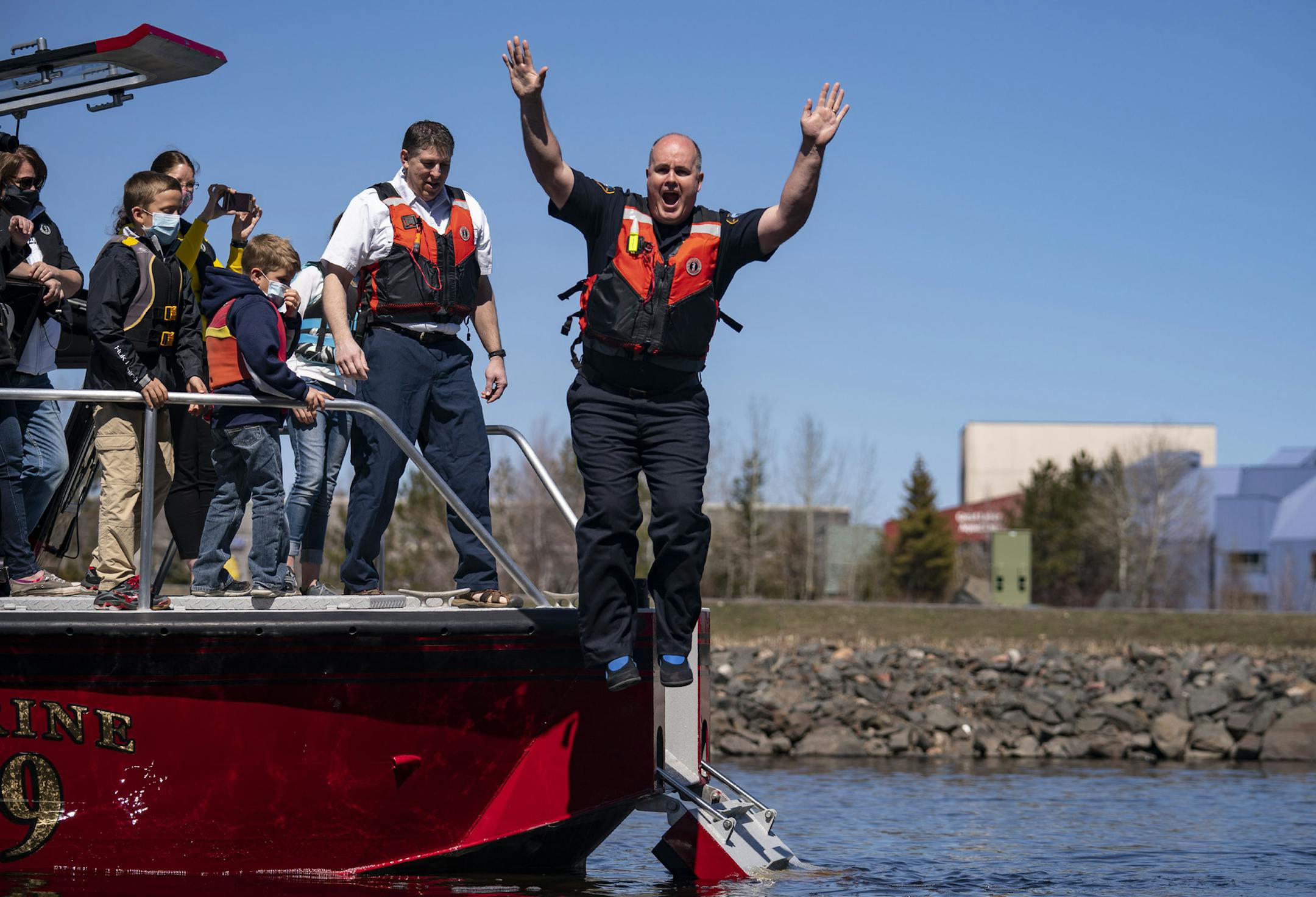 Duluth Police Chief Mike Tusken jumped into Lake Superior to show his appreciation for local kids, Brea, Dawson and Bryce Parrott, who raised $5,790 so far via gofundme in support of medical workers.. ]
ALEX KORMANN • alex.kormann@startribune.com Duluth Police Chief Mike Tusken and Fire Chief Shawn Krizaj jumped into Lake Superior to show their appreciation for local kids, Brea, Dawson and Bryce Parrott, who raised $5,790 so far via gofundme in support of medical workers.