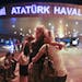 Passengers embrace each other at the entrance to Istanbul's Ataturk airport, early Wednesday, June 29, 2016 following their evacuation after a blast. 