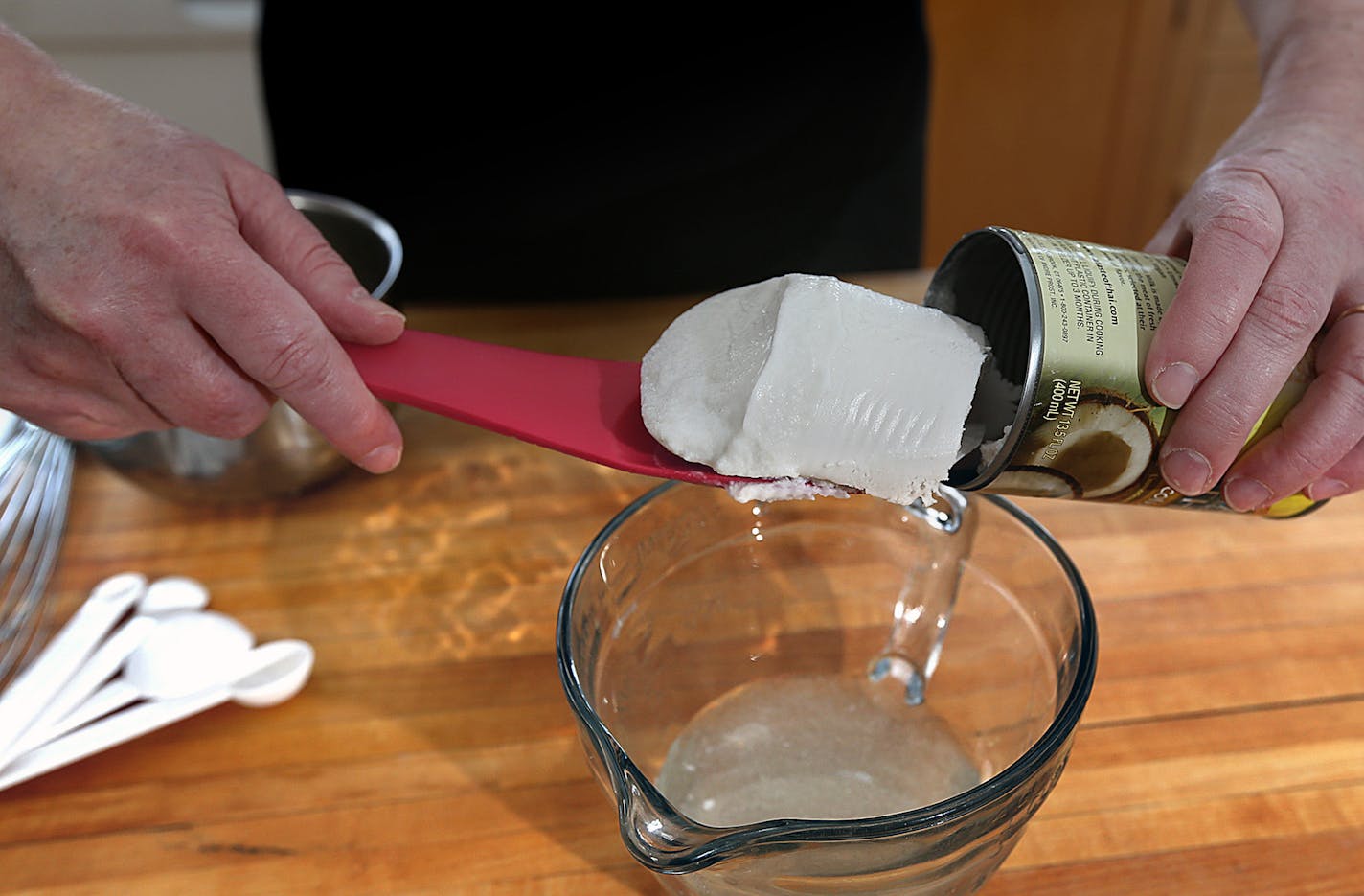 Coconut cake.] JIM GEHRZ &#x201a;&#xc4;&#xa2; jgehrz@startribune.com / Minneapolis, MN / April 4, 2014 / 1:00 PM BACKGROUND INFORMATION: Reporter Kim Ode bakes a coconut cake for Baking Central, complete with step-by-step photos showing the making of batter and custard, assembling and decorating.