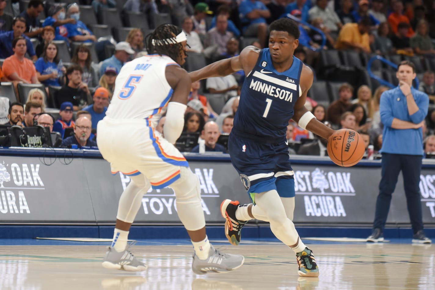 Minnesota Timberwolves forward Anthony Edwards (1) tries to push past Oklahoma City Thunder forward Luguentz Dort (5) in the first half of an NBA basketball game, Sunday, Oct. 23, 2022, in Oklahoma City. (AP Photo/Kyle Phillips)