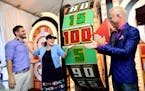 Brooklyn Park native Angelica McDaniel, head of CBS daytime programming spun the wheel with "The Price is Right" stars James O'Halloran (left) and Geo
