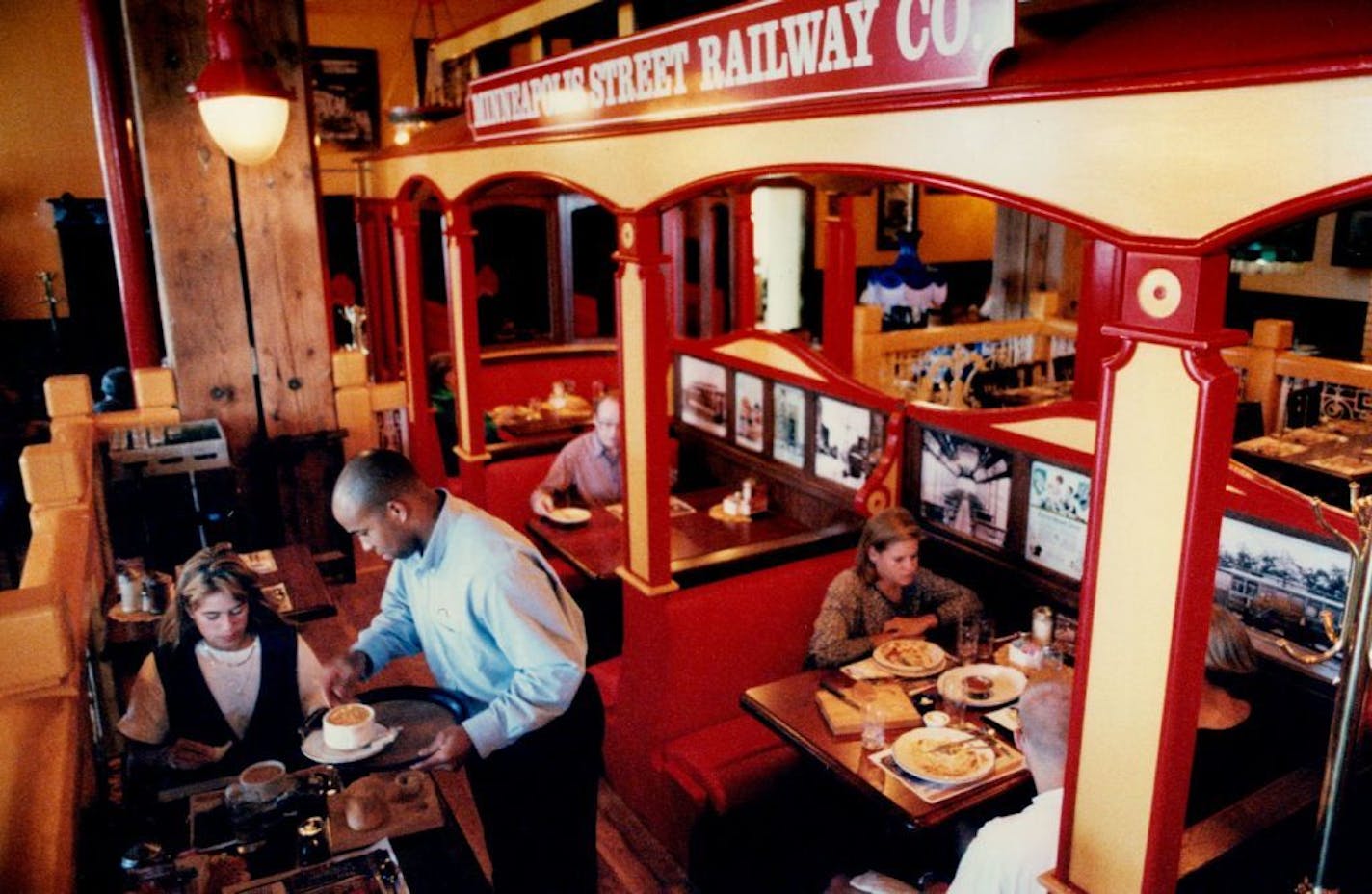 July 28, 1994 Customers enjoy the old-fashioned decor at the Old Spaghetti Factory. Pieces such as the trolley car incorporate the needs of the handicapped. It was designed from information and drawings taken from the Electric Railway Dictionary published in 1911 in New York. A. Meyer