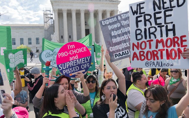 Anti-Abortion and Abortion-rights activists rally outside the Supreme Court, Wednesday, April 24, 2024, in Washington.