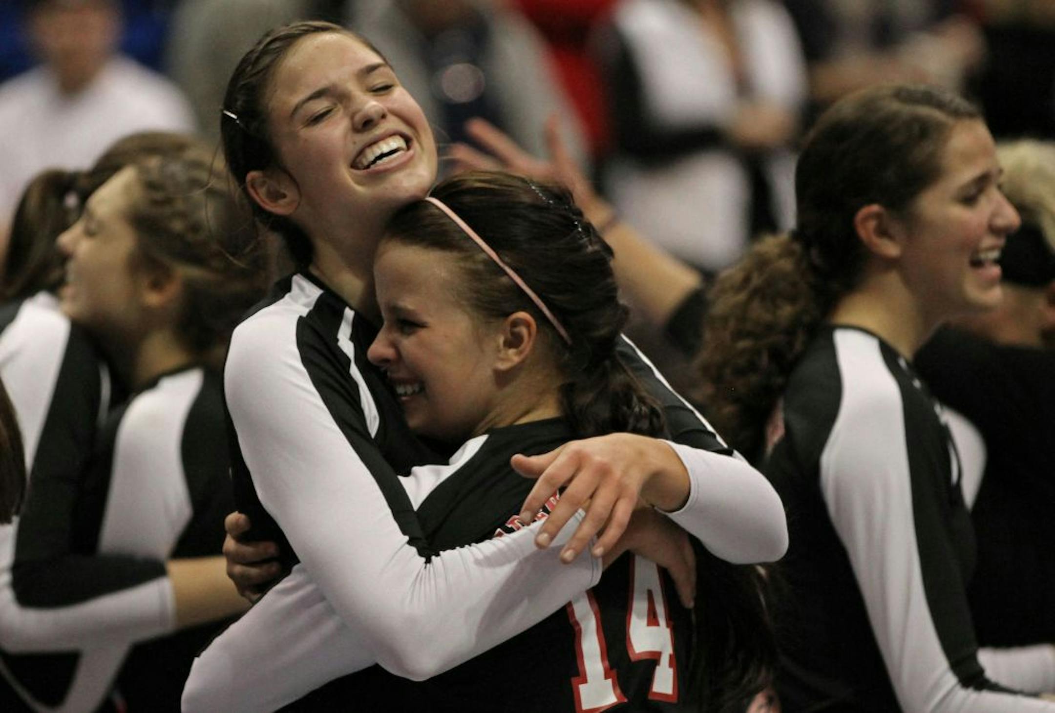 Eden Prairie's Sarah Wilhite and Camille Schultz celebrate the Eagles Class 3A championship win over Lakeville North on 11/12/11.