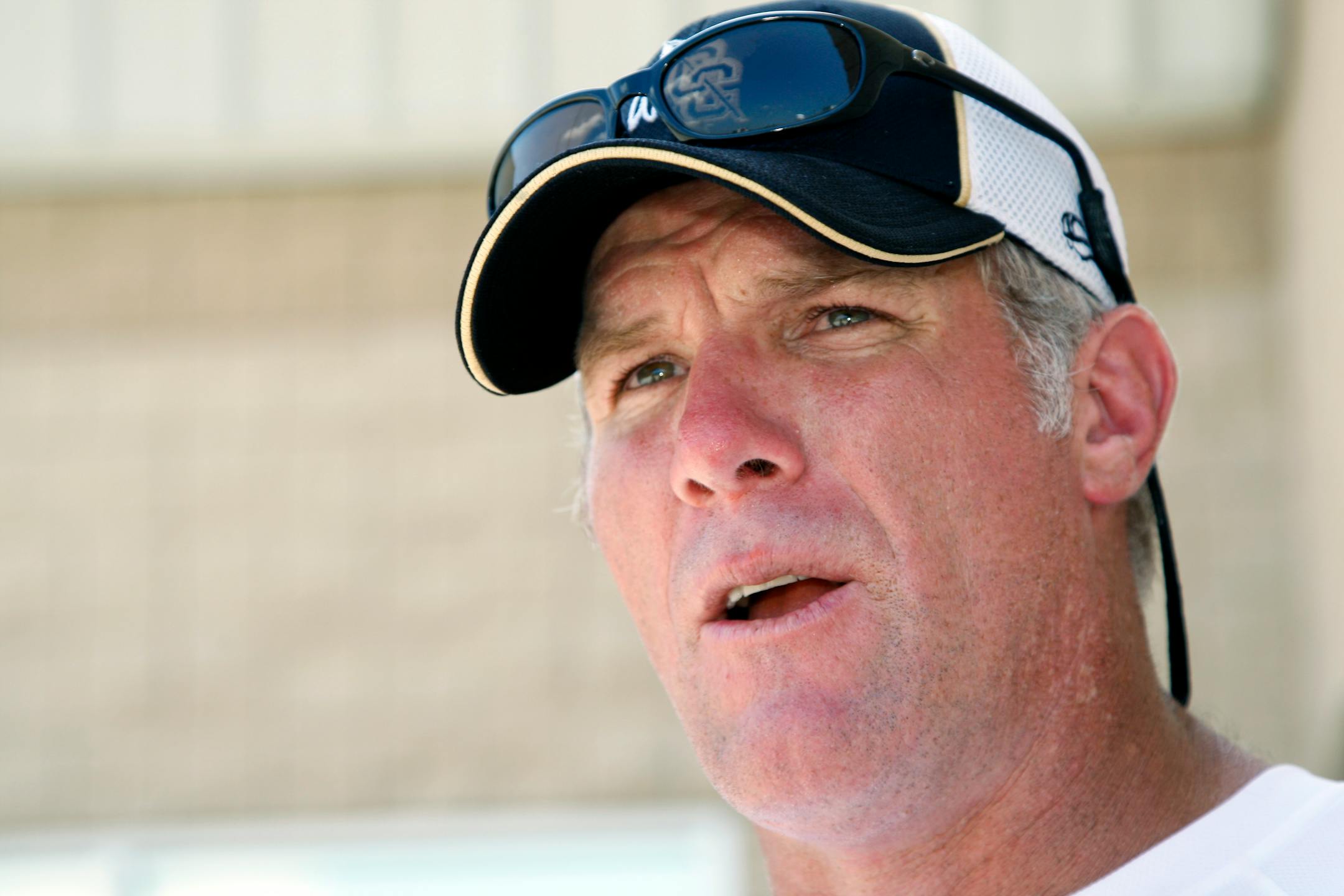 FILE - In this July 30, 2012, file photo, former NFL quarterback Brett Favre speaks to the media in Hattiesburg, Miss. Favre says he couldn't be happier to see Peyton Manning on the brink of breaking his NFL record of 508 touchdown throws. Manning has 503 heading into Denver's road game Sunday, Oct. 12, 2014, against the New York Jets. (AP Photo/Rogelio V. Solis, File)