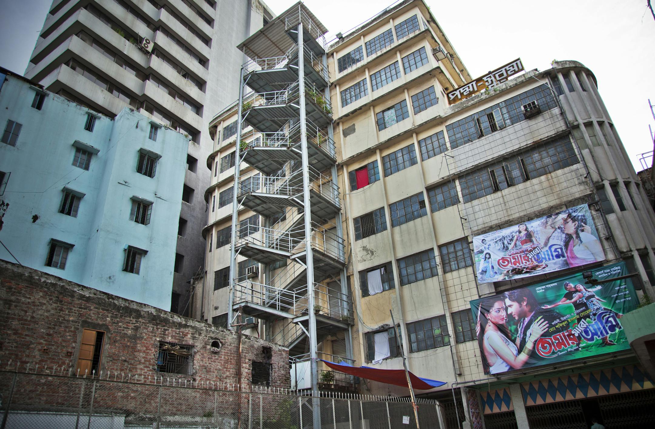 The Al-Hamra Garments building, where two engineers discovered that the eight-story factory was partly propped up by temporary cast-iron pillars, in Dhaka, Bangladesh, July 2, 2013. To address concerns about unsafe buildings, government officials and industry leaders called for inspections to ensure the structural integrity of the country's 5,000 garment factories, but the inspections process is disorganized and haphazard, with unclear lines of authority. (Khaled Hasan/The New York Times)