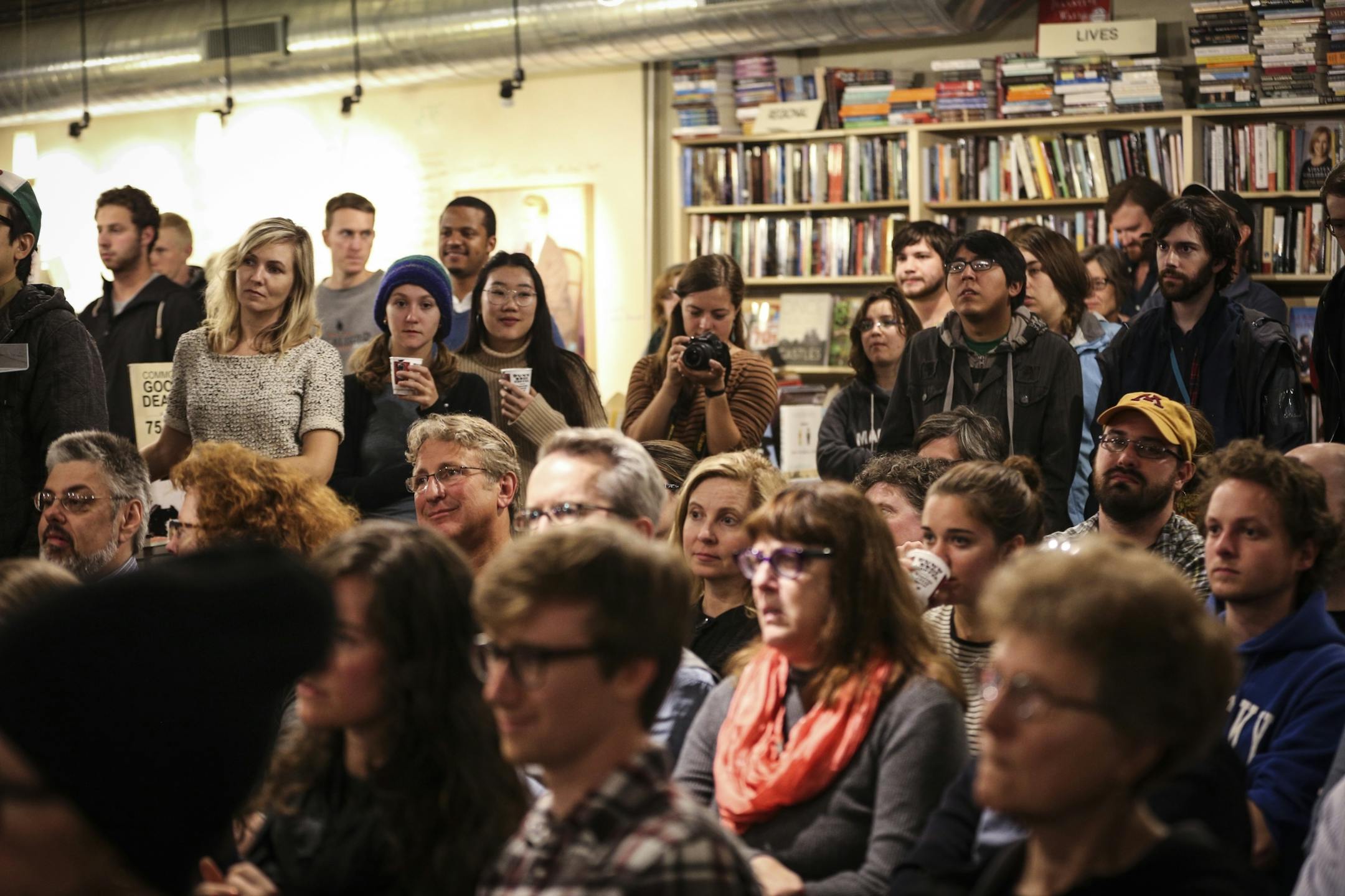 A large group of people watched author Marlon James as he read excerpts his new book "A Brief History of Seven Killings" at Common Good Books on Wednesday, October 3, 2014 in St. Paul, Minn.