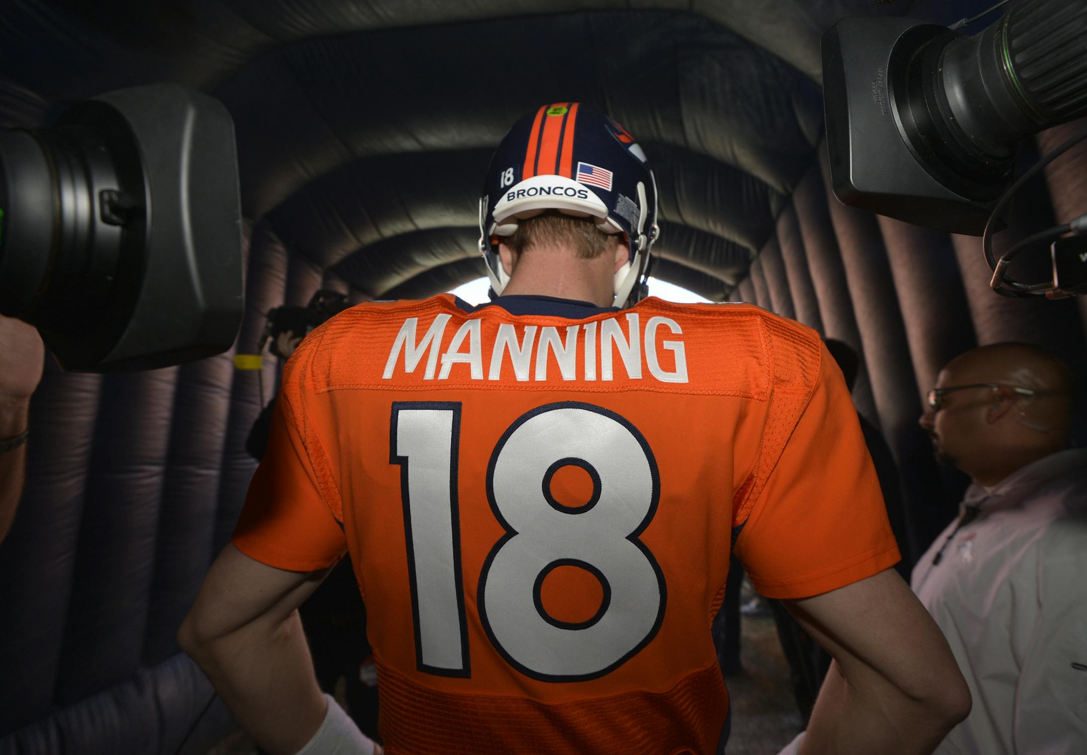 Denver Broncos quarterback Peyton Manning waits to be introduced during the first half of an NFL football game against the New England Patriots in Denver, Md., Sunday, Jan. 19, 2014. (AP Photo/Jack Dempsey) ORG XMIT: NYOTK
